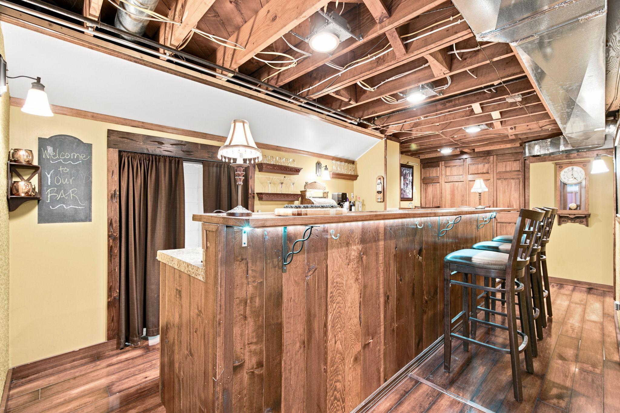 Unique rustic wet bar adds character to the lower level and creates the perfect space for entertaining