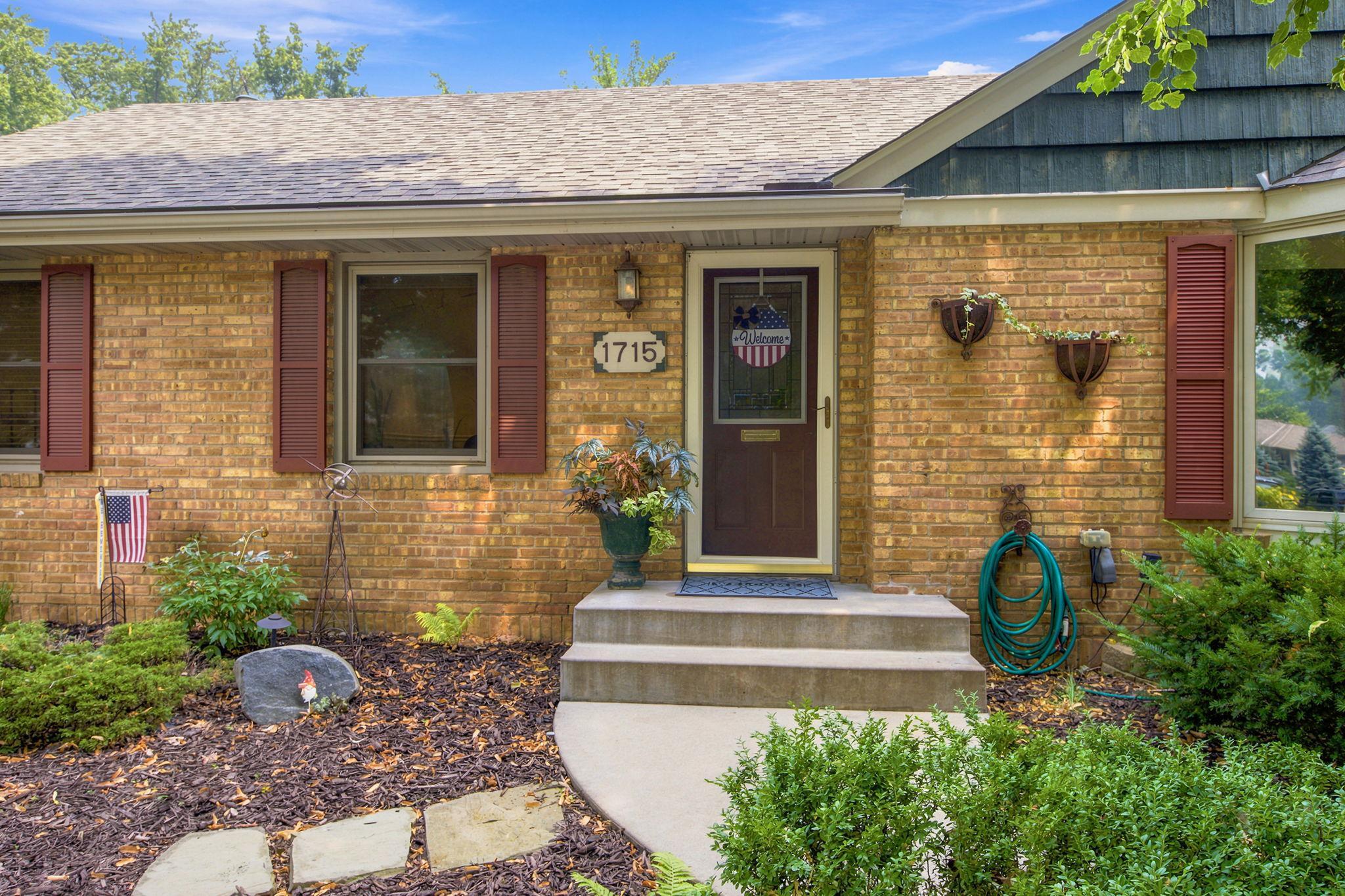 Beautiful curb appeal with attractive maintenance free brick