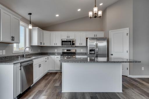 Photos are of a like(not exact) home in different location. Finishes may be different in actual home.