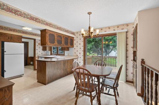 The informal dining room features a built-in hutch and patio doors that bring you to the deck and nice backyard.