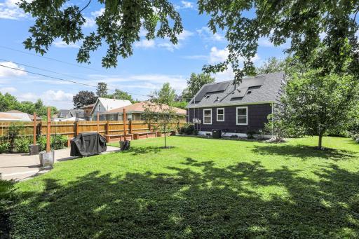 Spacious backyard with beautiful wood privacy fence all around. Great for children and pets.