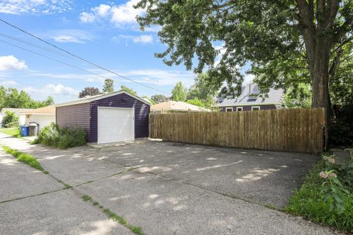 The detached 1-car garage is oversized at 14' x 21'. 2 additional off-street parking stalls alongside the privacy fence.