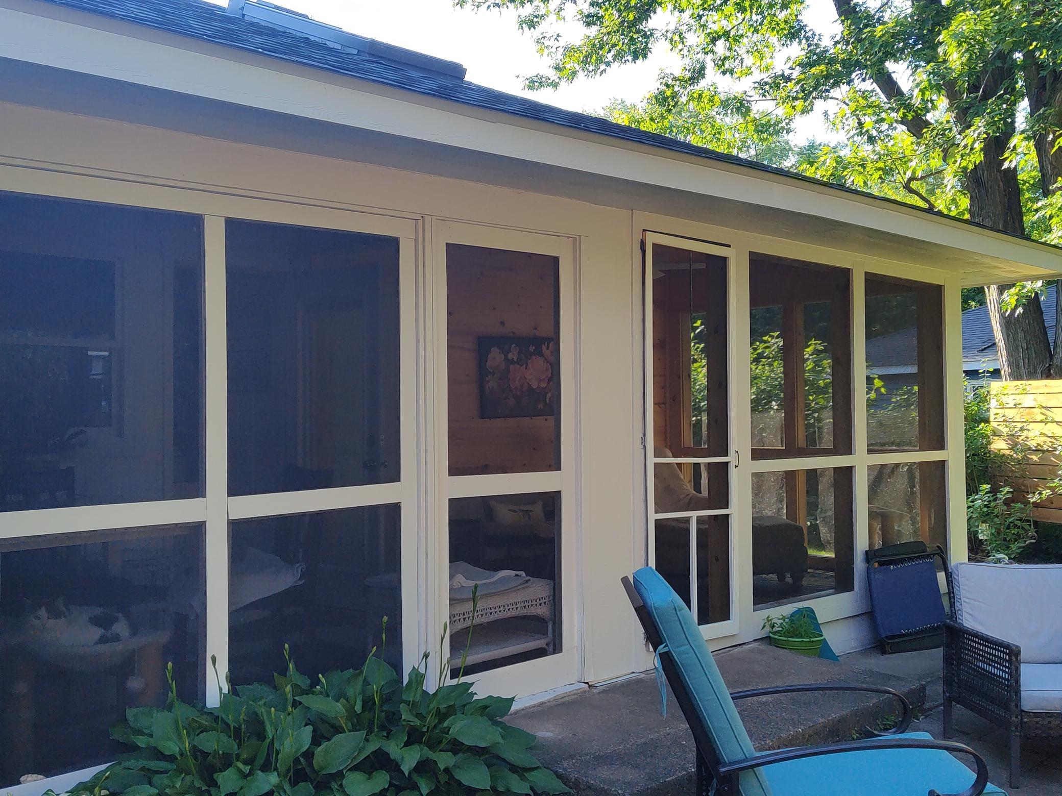 Large screened Porch that views the beautiful rear yard