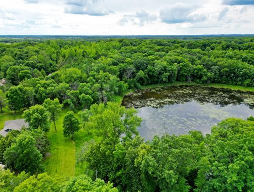 Many mature trees, and a pond present a beautiful setting for your future home and enjoyment.