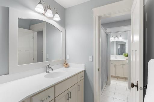 Separate vanity areas in the shared en-suite bathroom