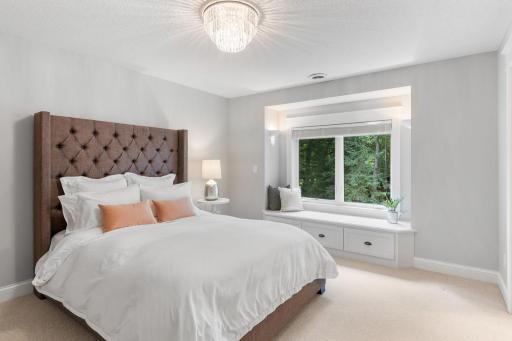 Fourth bedroom on the upper level provides a built-in bench and storage