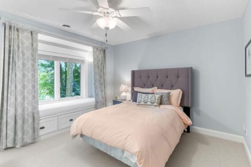 Third bedroom on the upper level also features built-in bench seating and storage