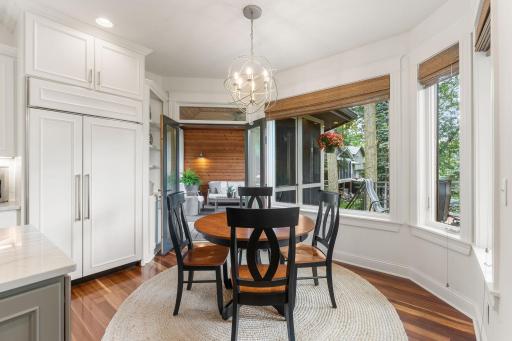 Informal dining space with access to the screened porch