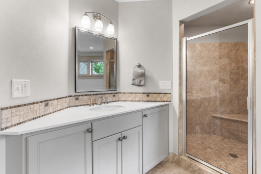 Dual vanity areas and sinks, plus double headed shower