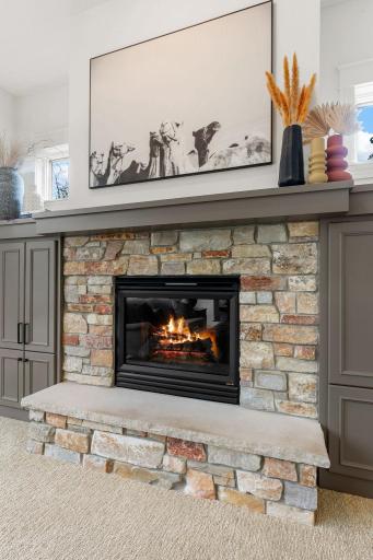 Beautiful stone surround fireplace and built ins for extra storage