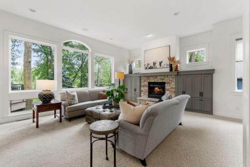 Living room with oversized windows and gas fireplace