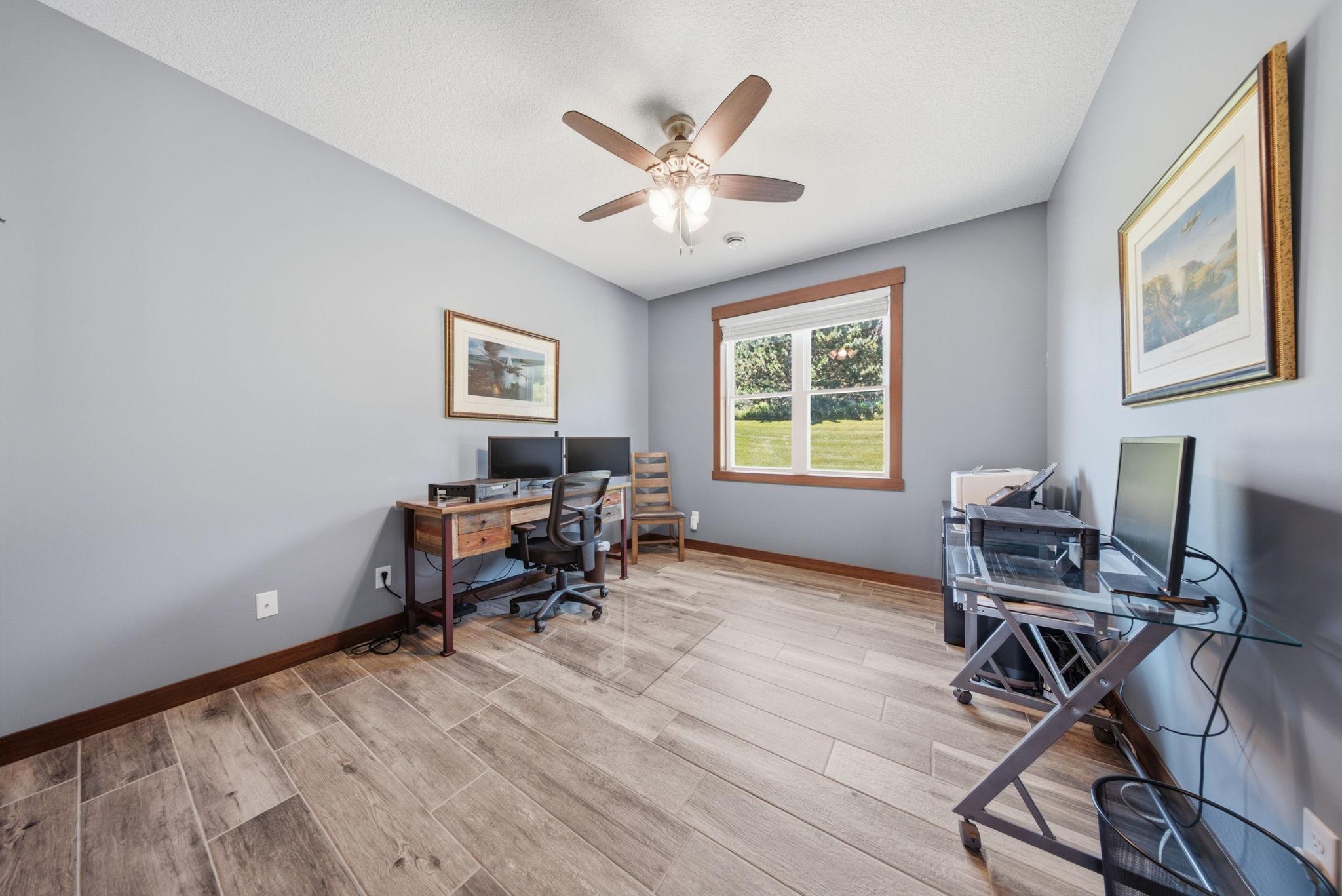 Versatile main-level bedroom, ideal for guests, a home office, or hobby room.