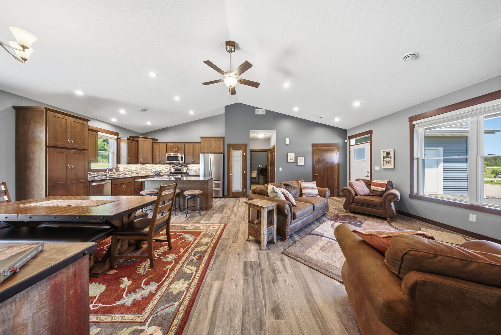 Spacious great room seamlessly connecting the living room, dining area, and kitchen.