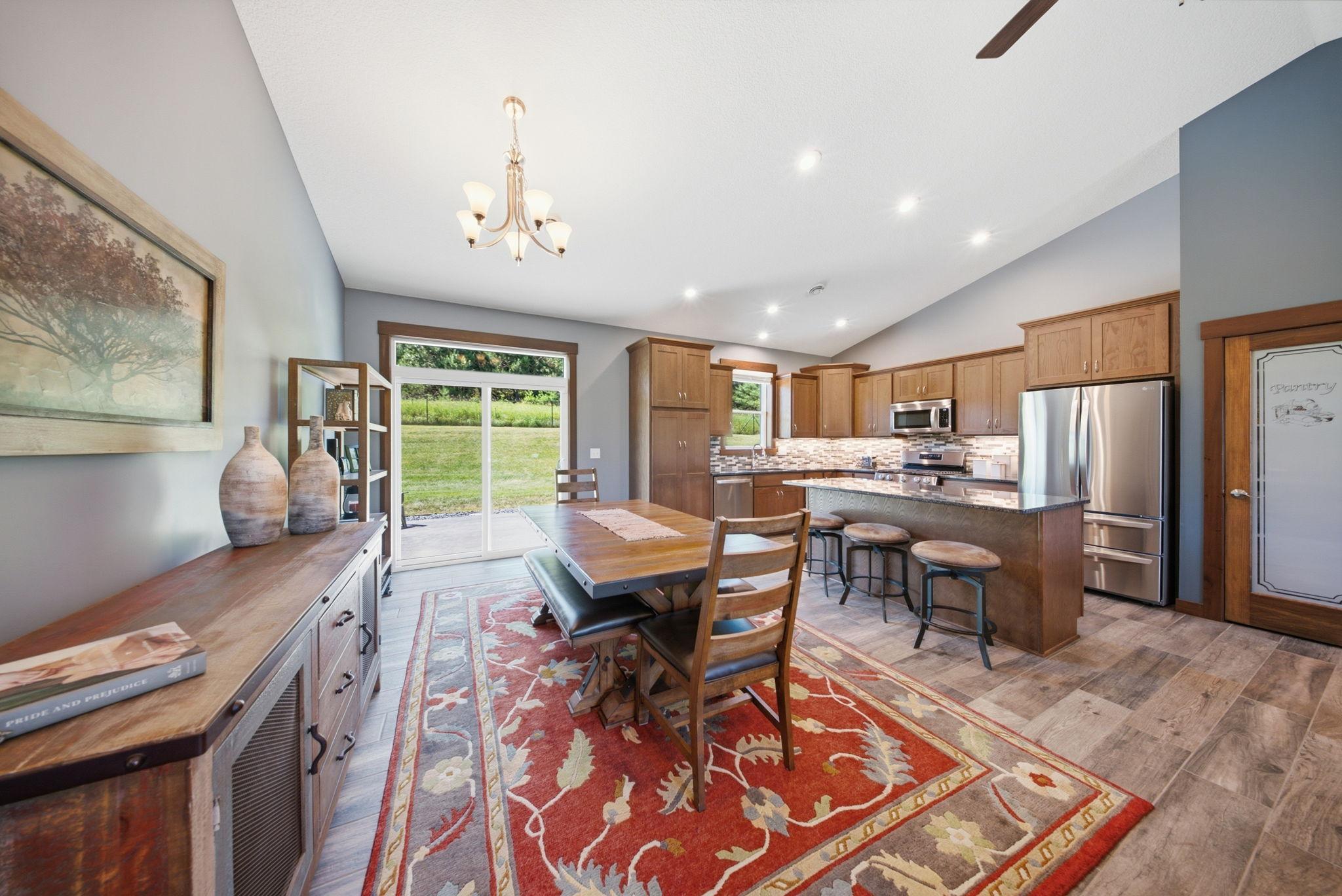 Dining area overlooks the backyard and opens directly to the patio.