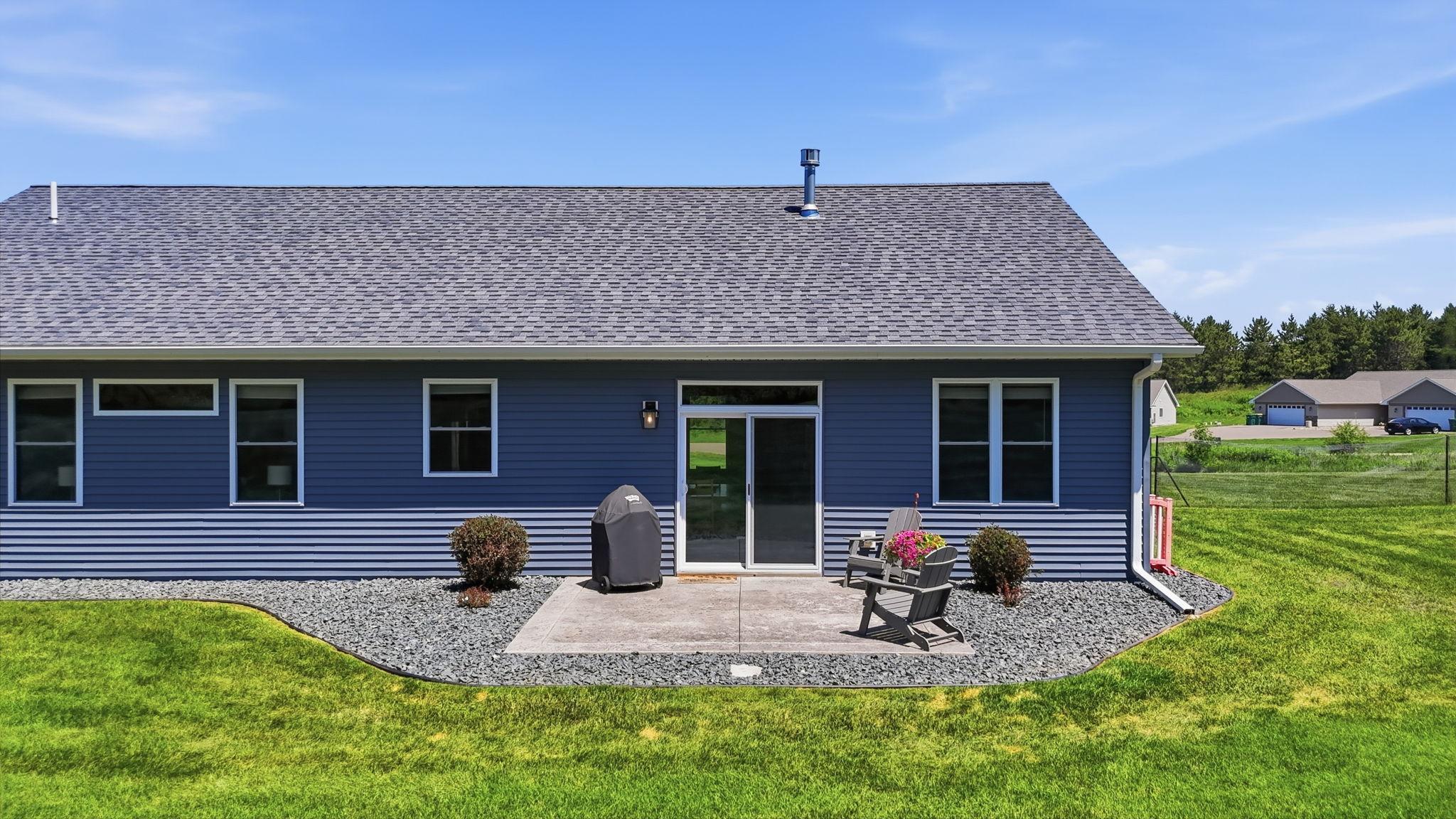 Step outside to a relaxing backyard patio—ideal for grilling or morning coffee.