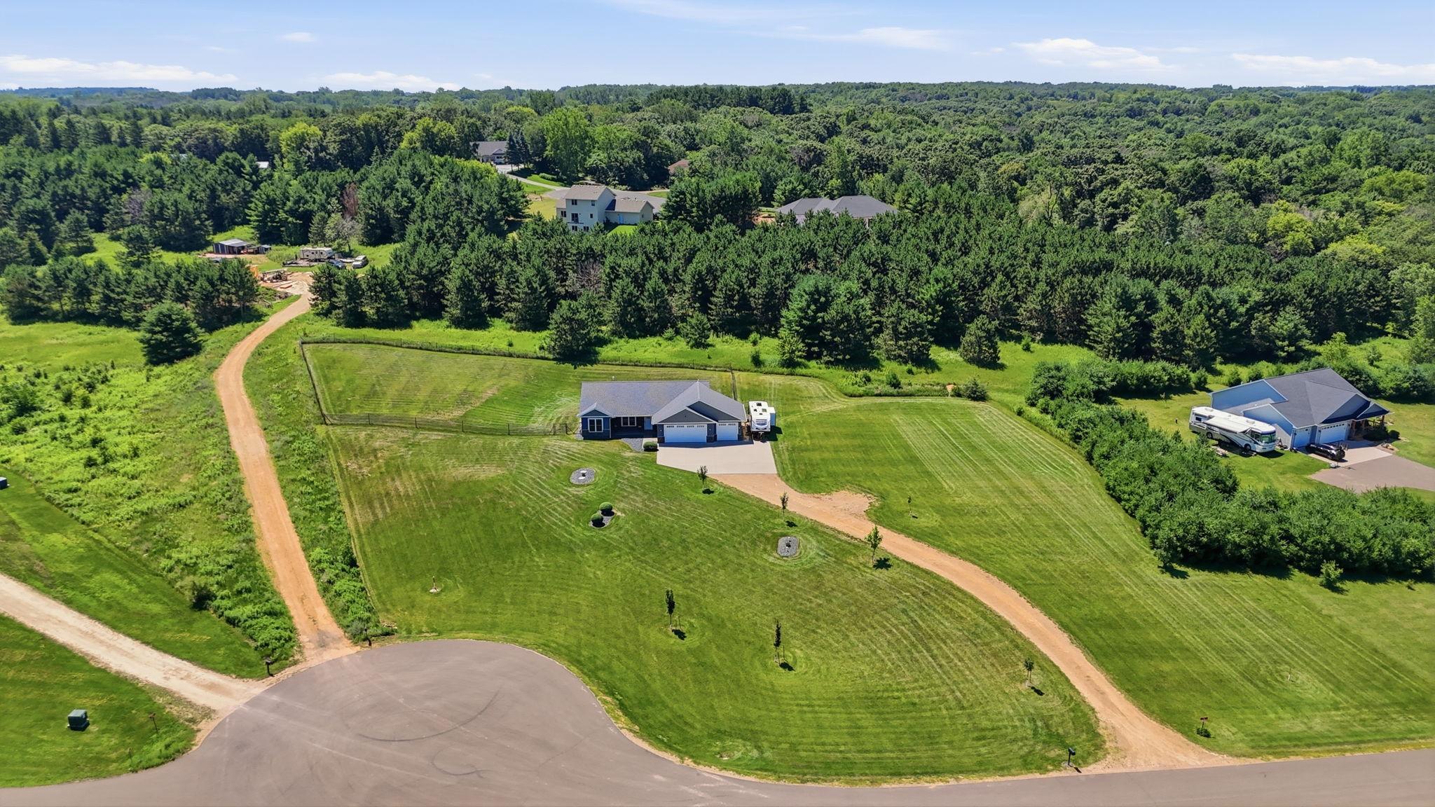 Expansive lot with an ideal blend of open lawn, privacy, and easy access to the neighborhood.