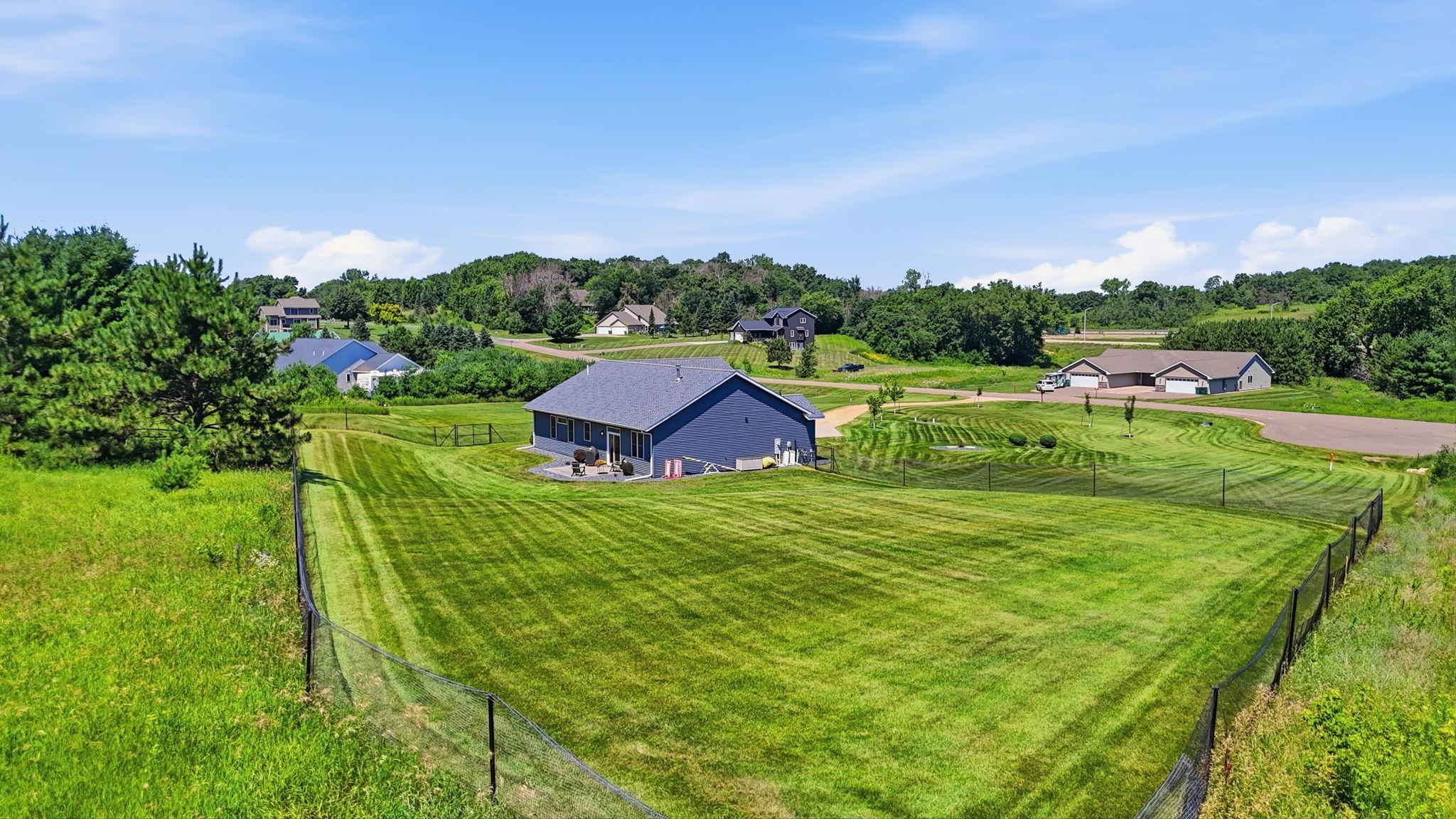 Large fenced backyard offers plenty of space.