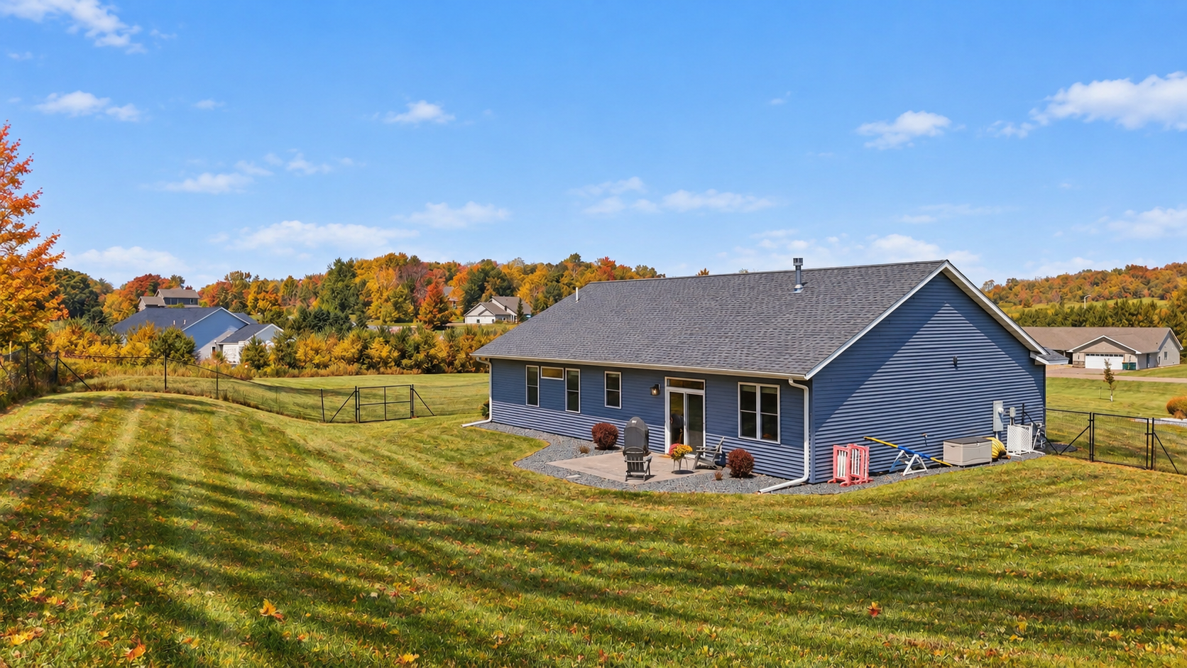 The backyard provides plenty of room to enjoy the outdoors while taking in the scenic surroundings.