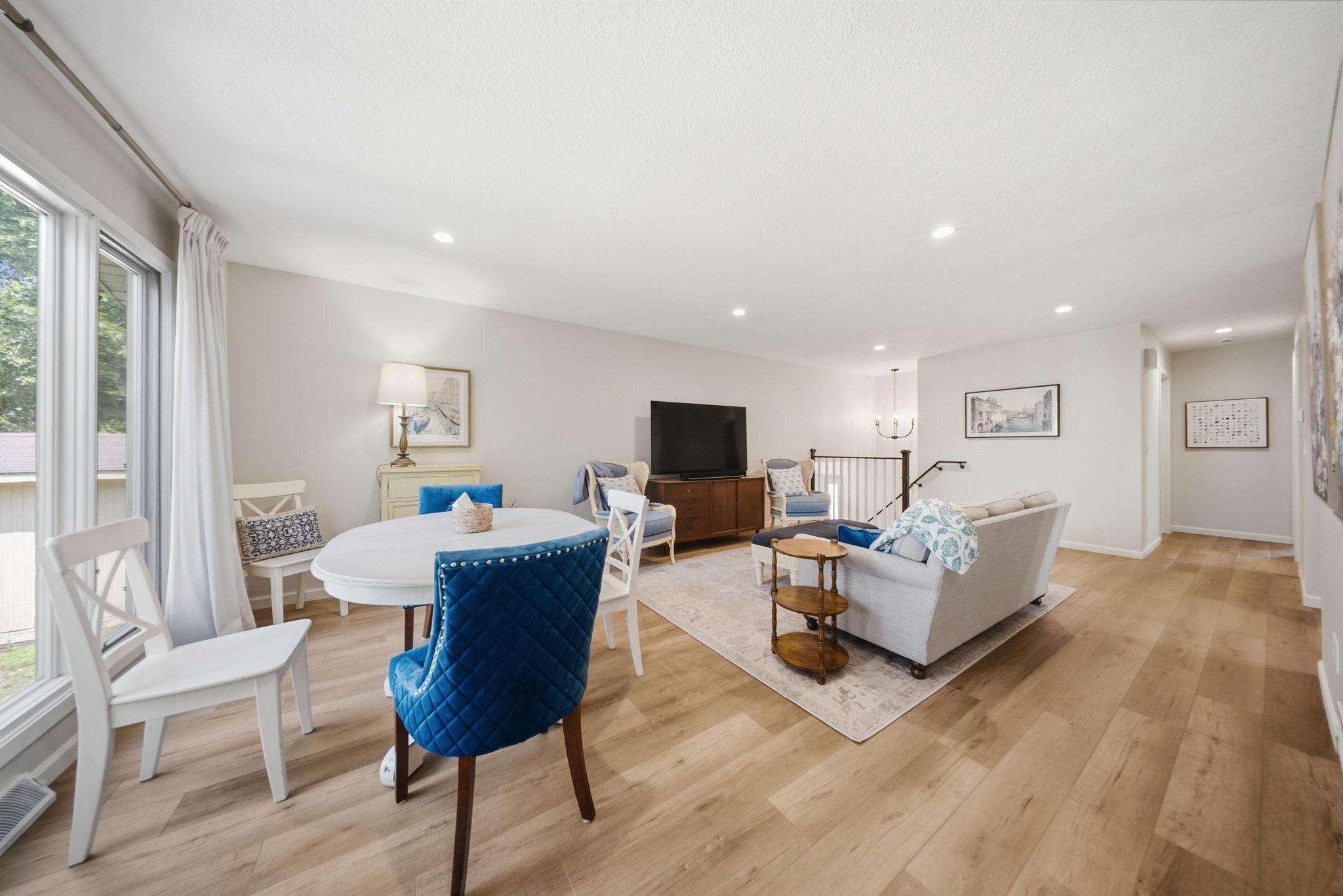 Living and dining areas flow seamlessly together with views of the backyard.