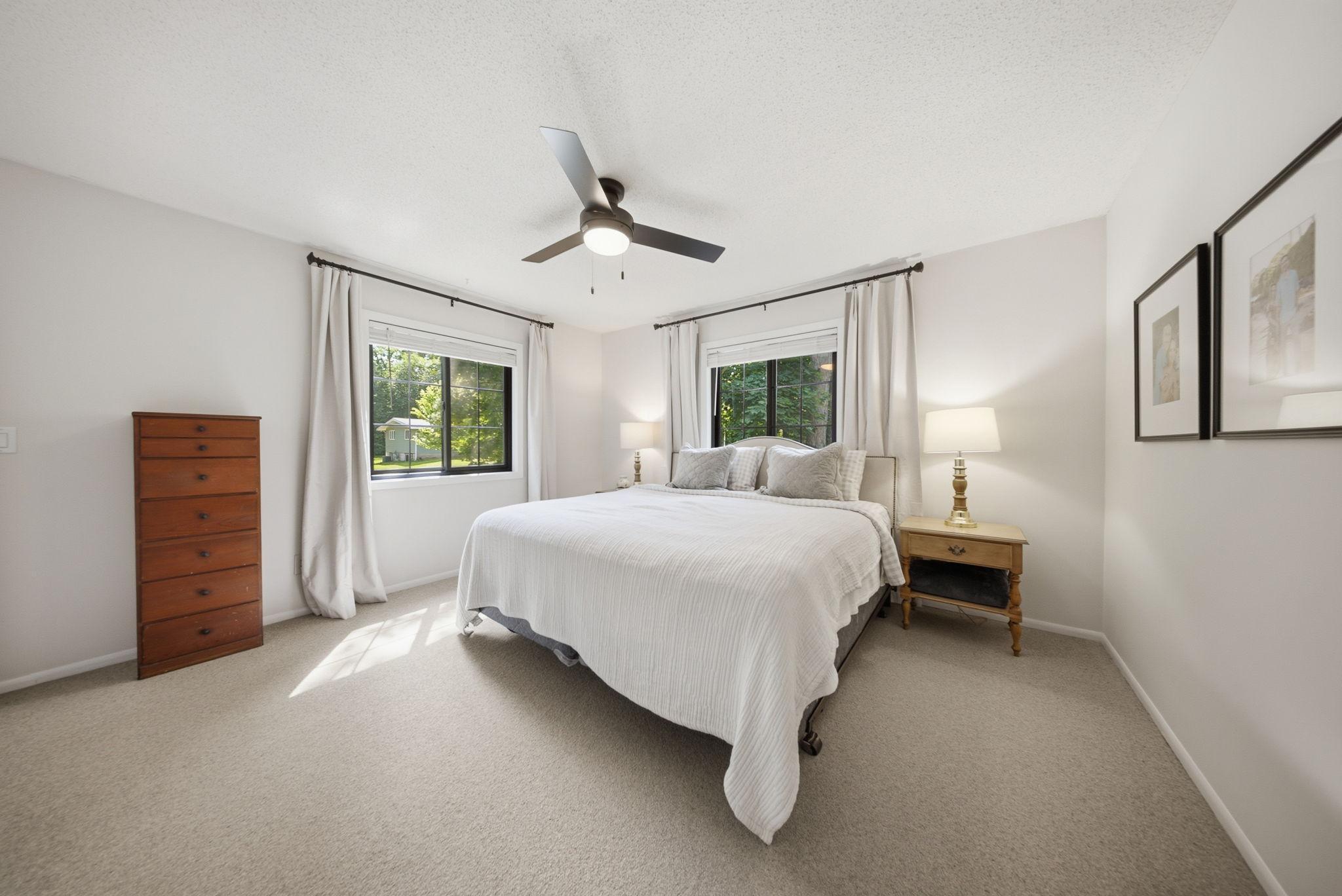 Spacious primary bedroom with dual closets and abundant natural light.
