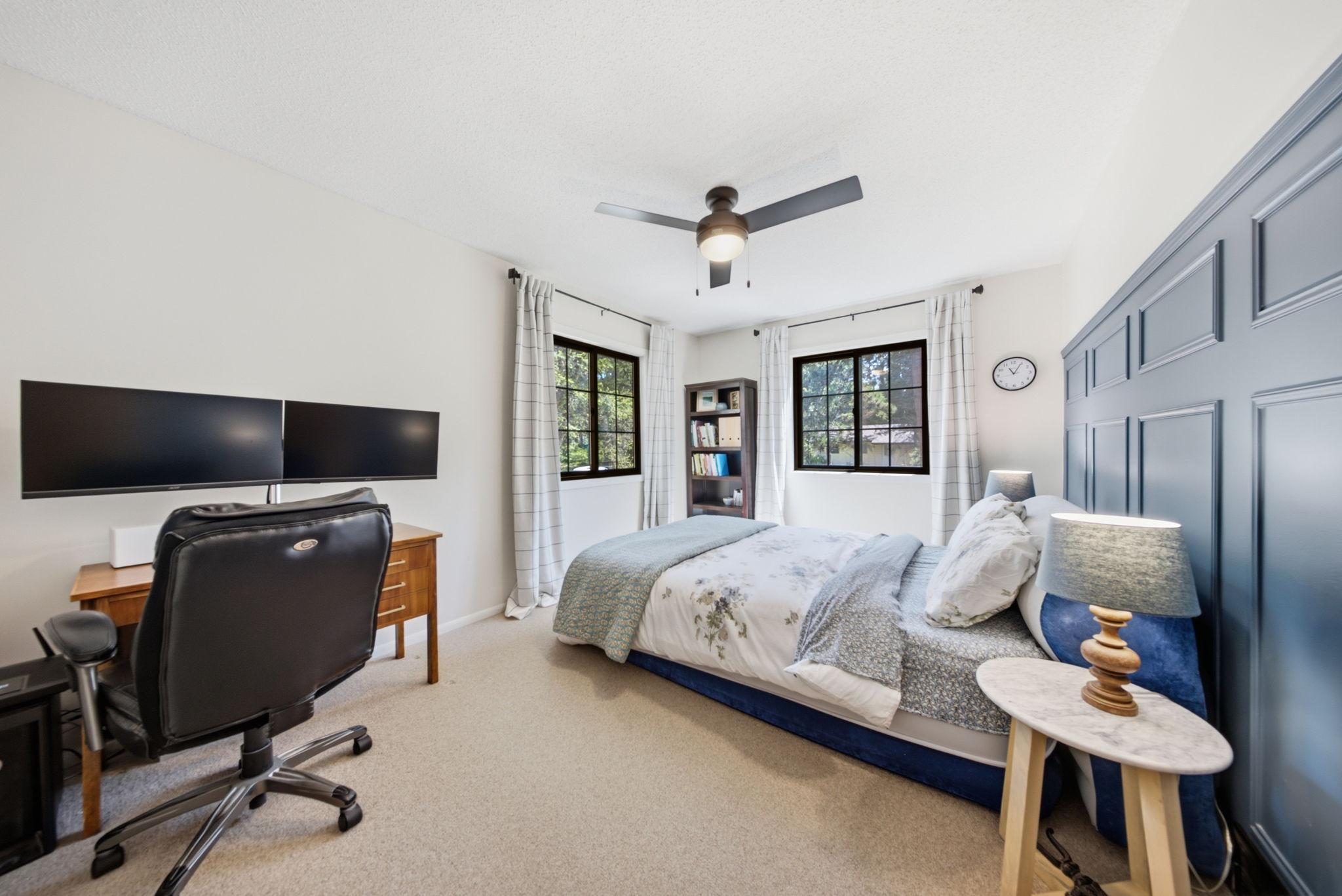 Comfortable secondary bedroom with updated accent wall and flexible layout.