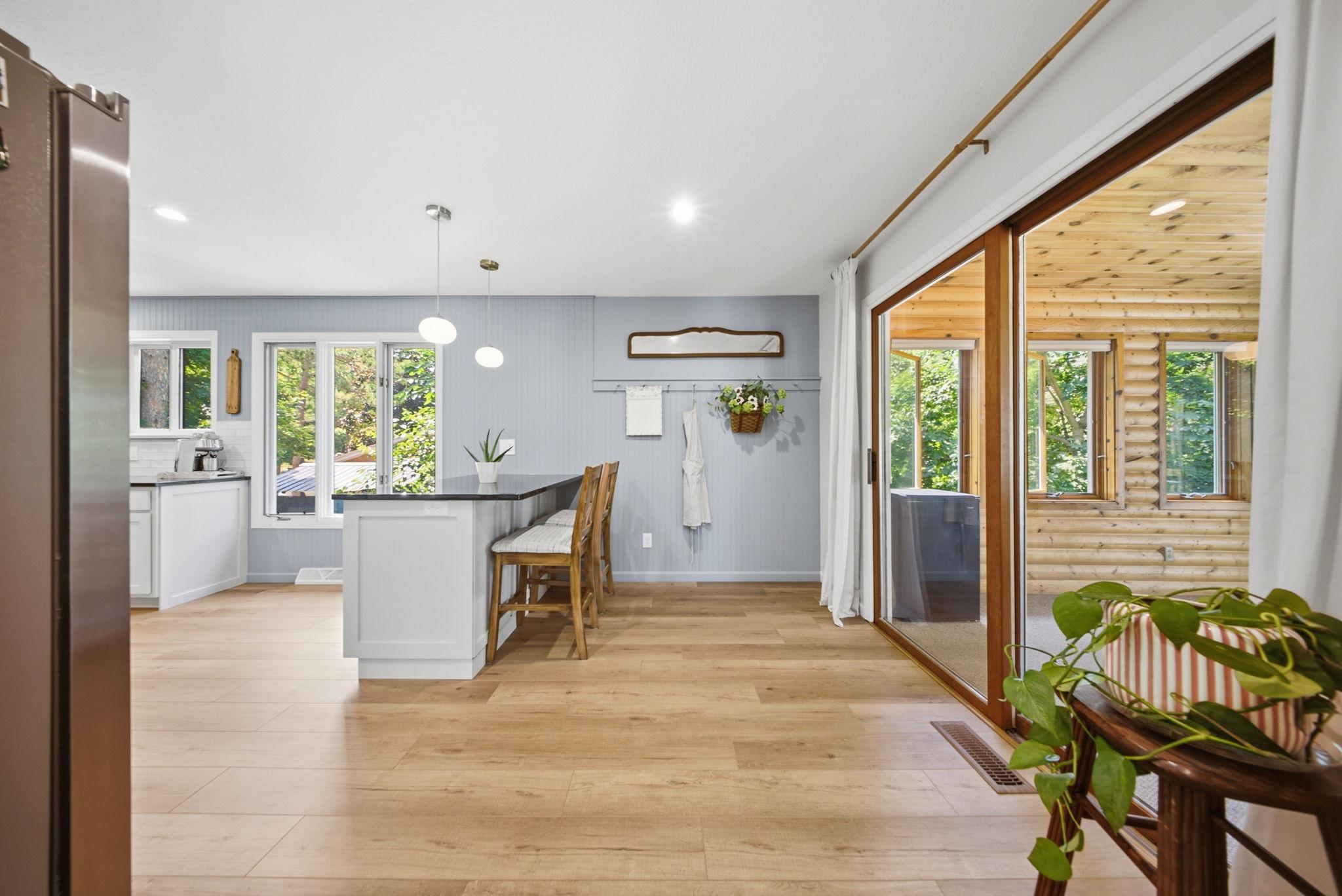 Easy flow from the kitchen to the three-season porch for indoor-outdoor living.