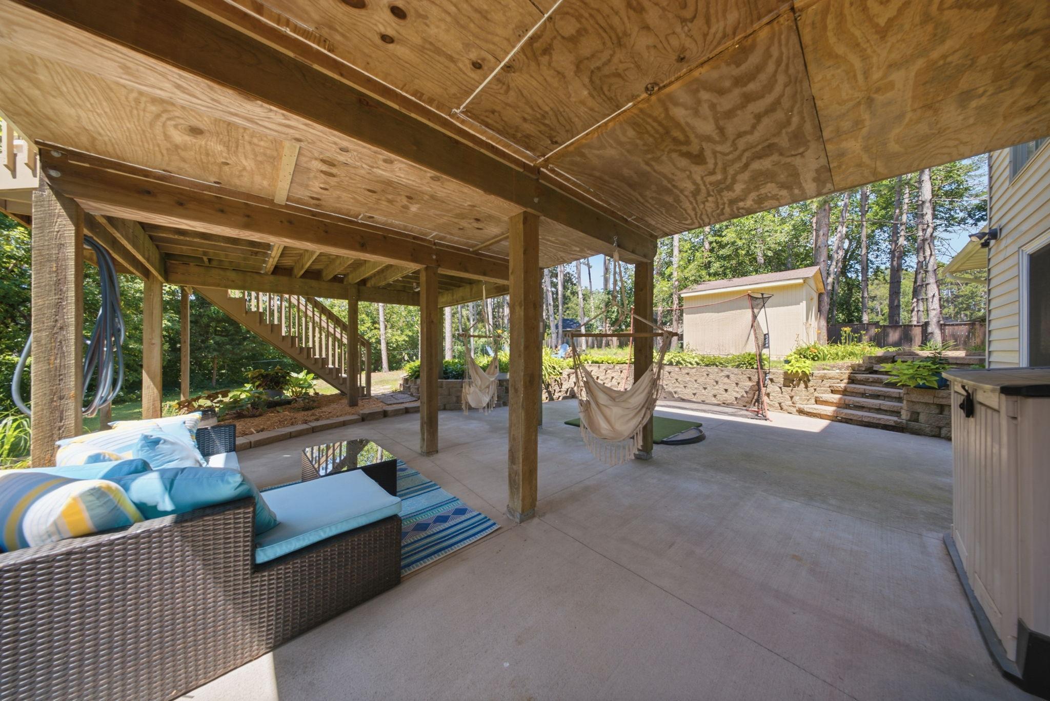 Expansive covered patio creates the perfect outdoor living space rain or shine.