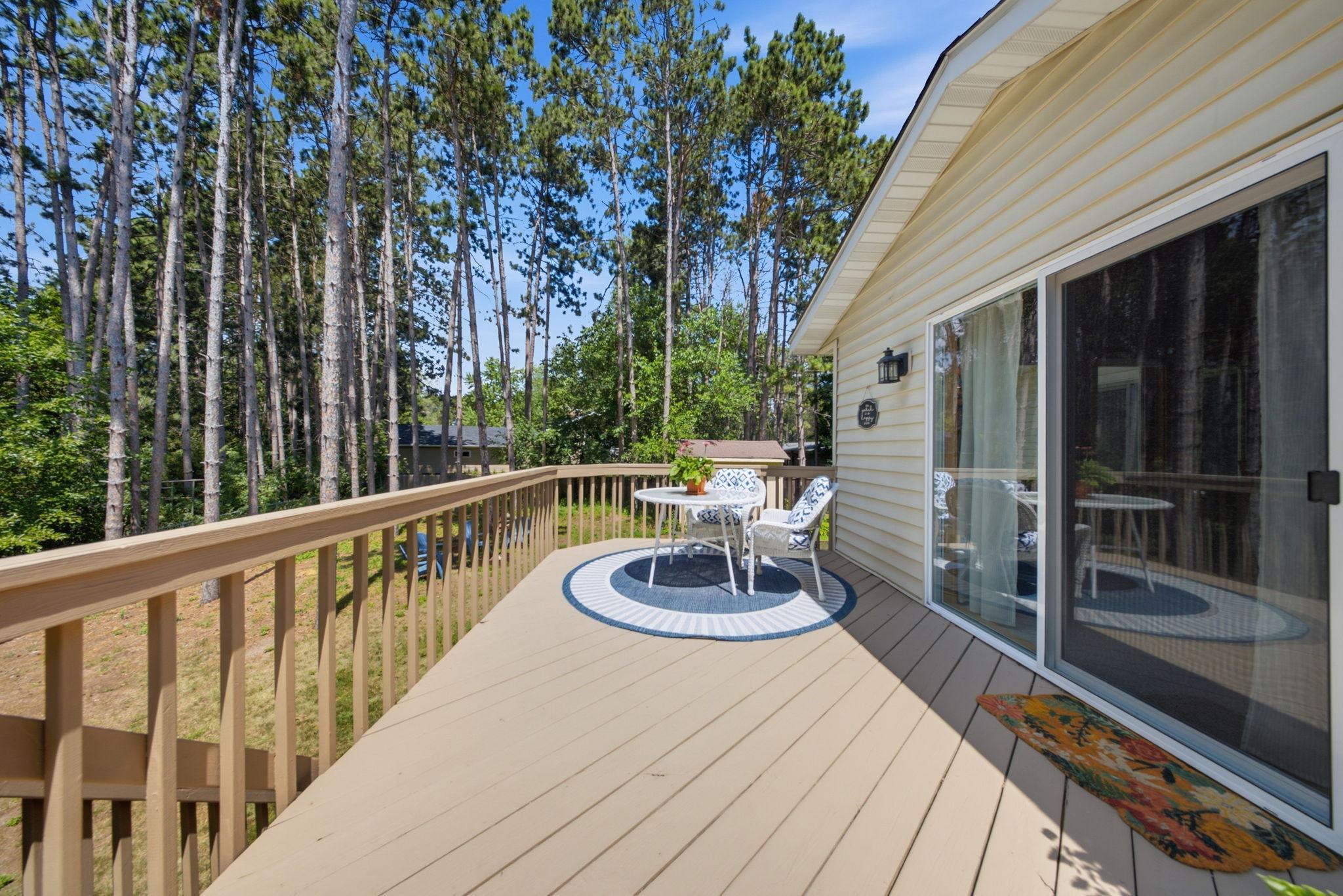 Expansive deck overlooking the private backyard.