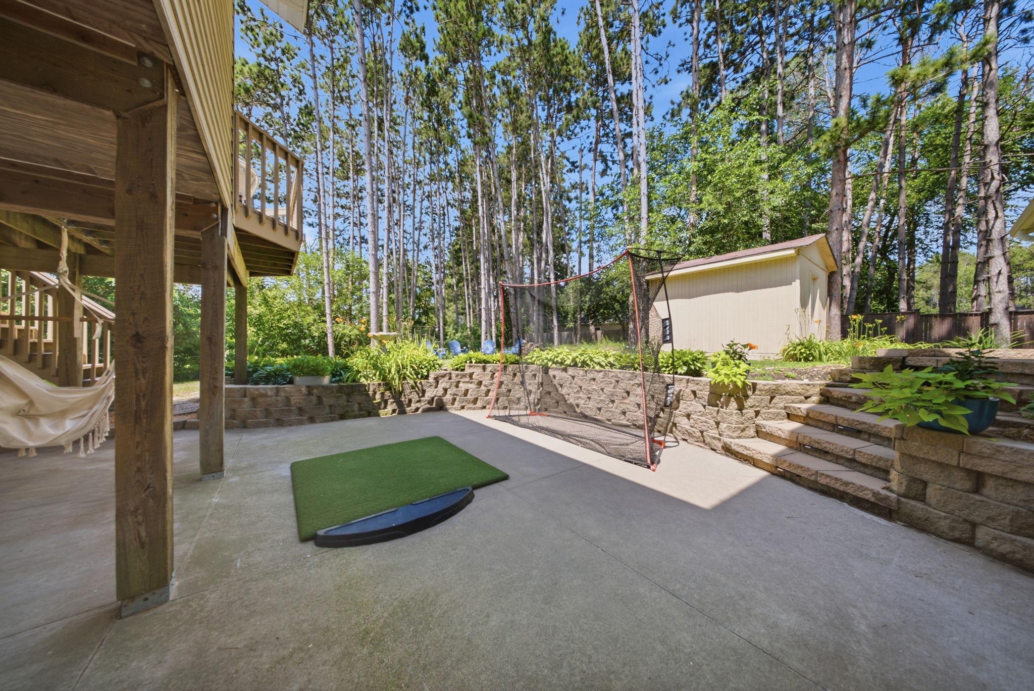 Plenty of room for games, practice, and entertaining in the thoughtfully designed backyard.