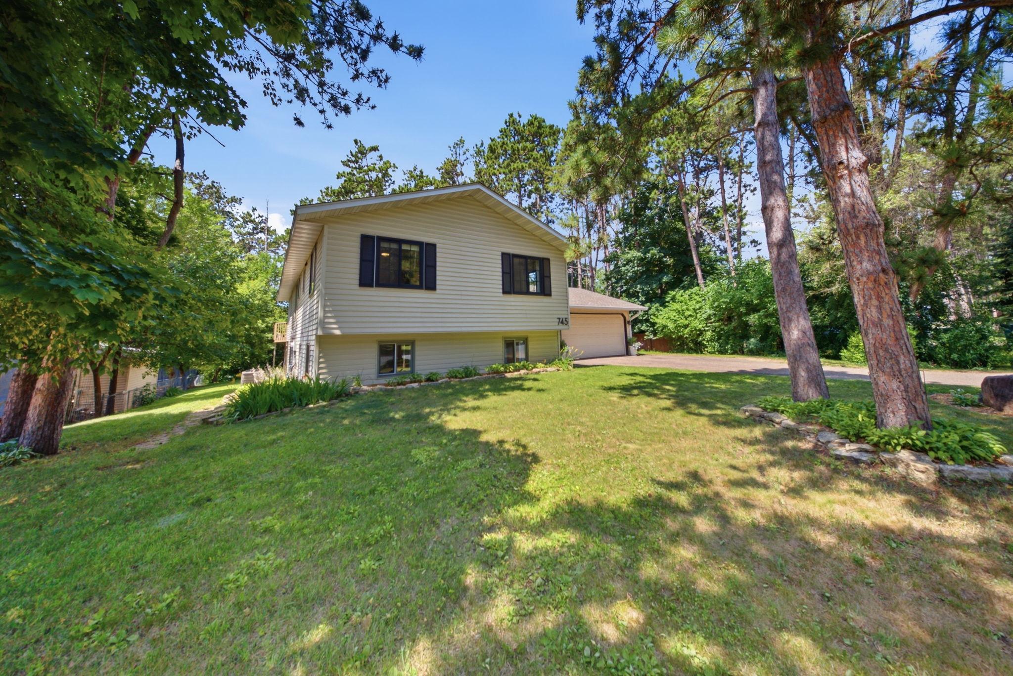 Welcome home to this beautifully maintained split-entry nestled on a mature, wooded lot.