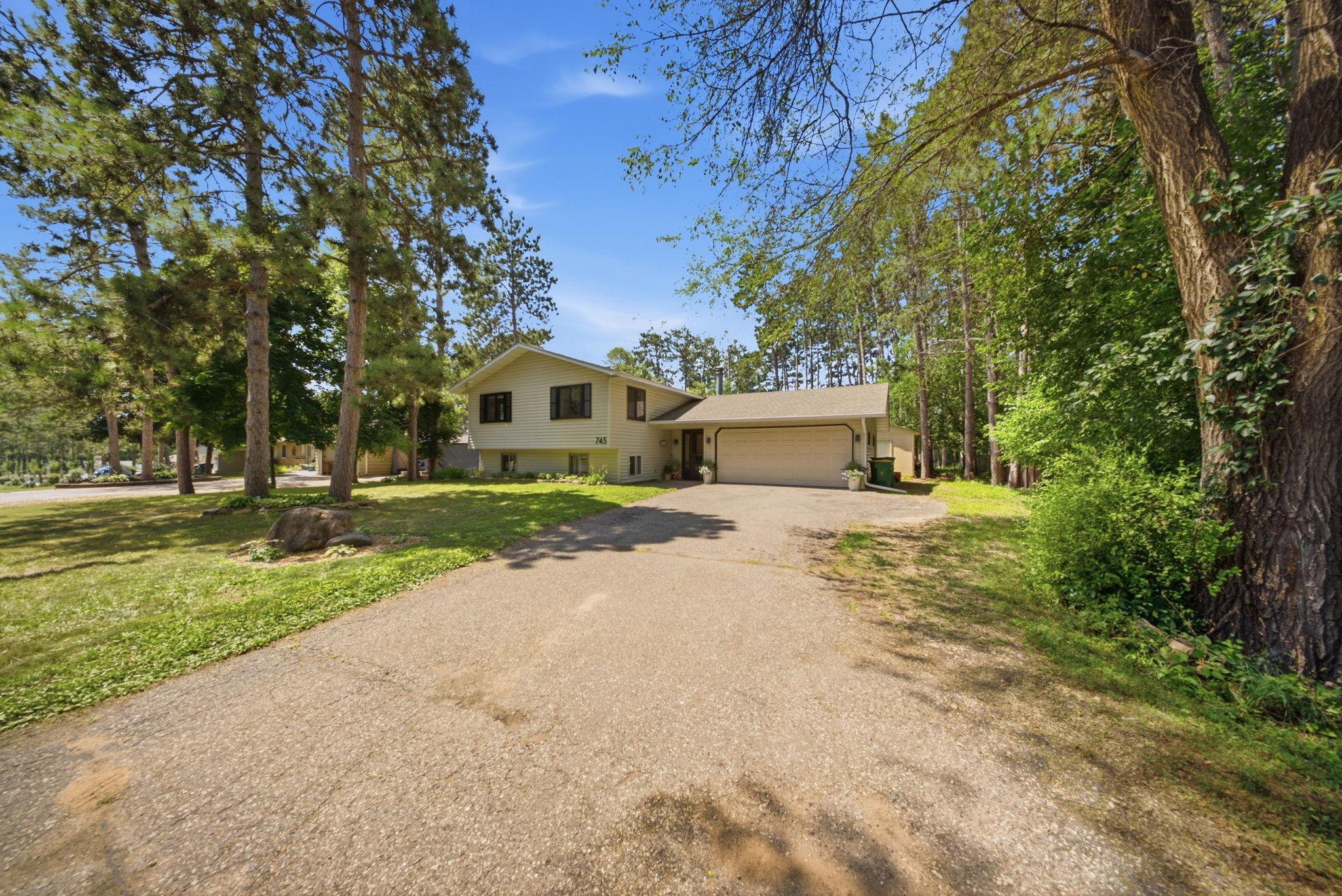 Spacious driveway with attached two-car garage