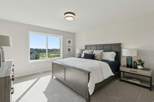 Spacious Primary Suite. Photos may not depict actual home plan configuration. Features/materials/finishes shown contain options that are not included in price. This home is under construction!