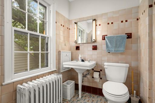 Classic ceramic tile bathroom on the upper level.