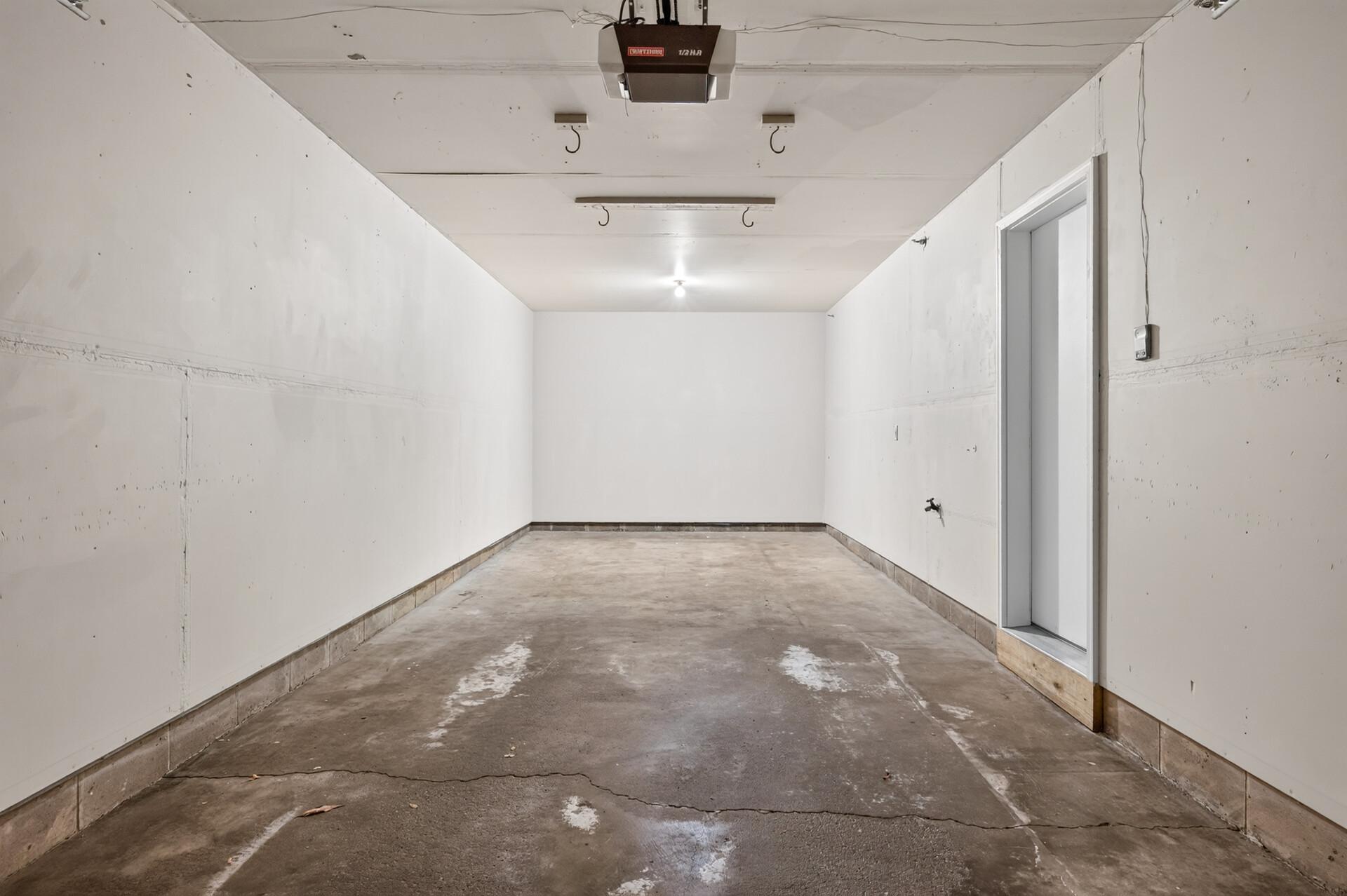 Tandem-style, double-deep garage offering space for multiple vehicles