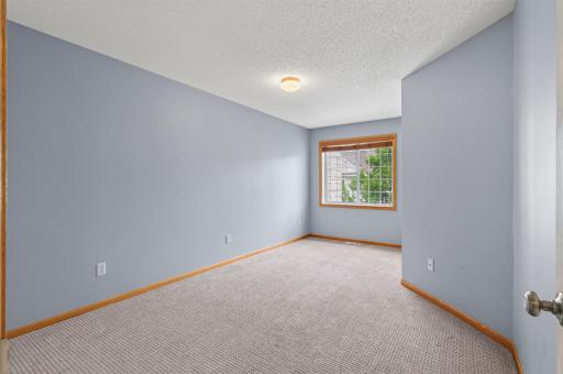 Spacious second bedroom perfect for guests, family, or a home office.