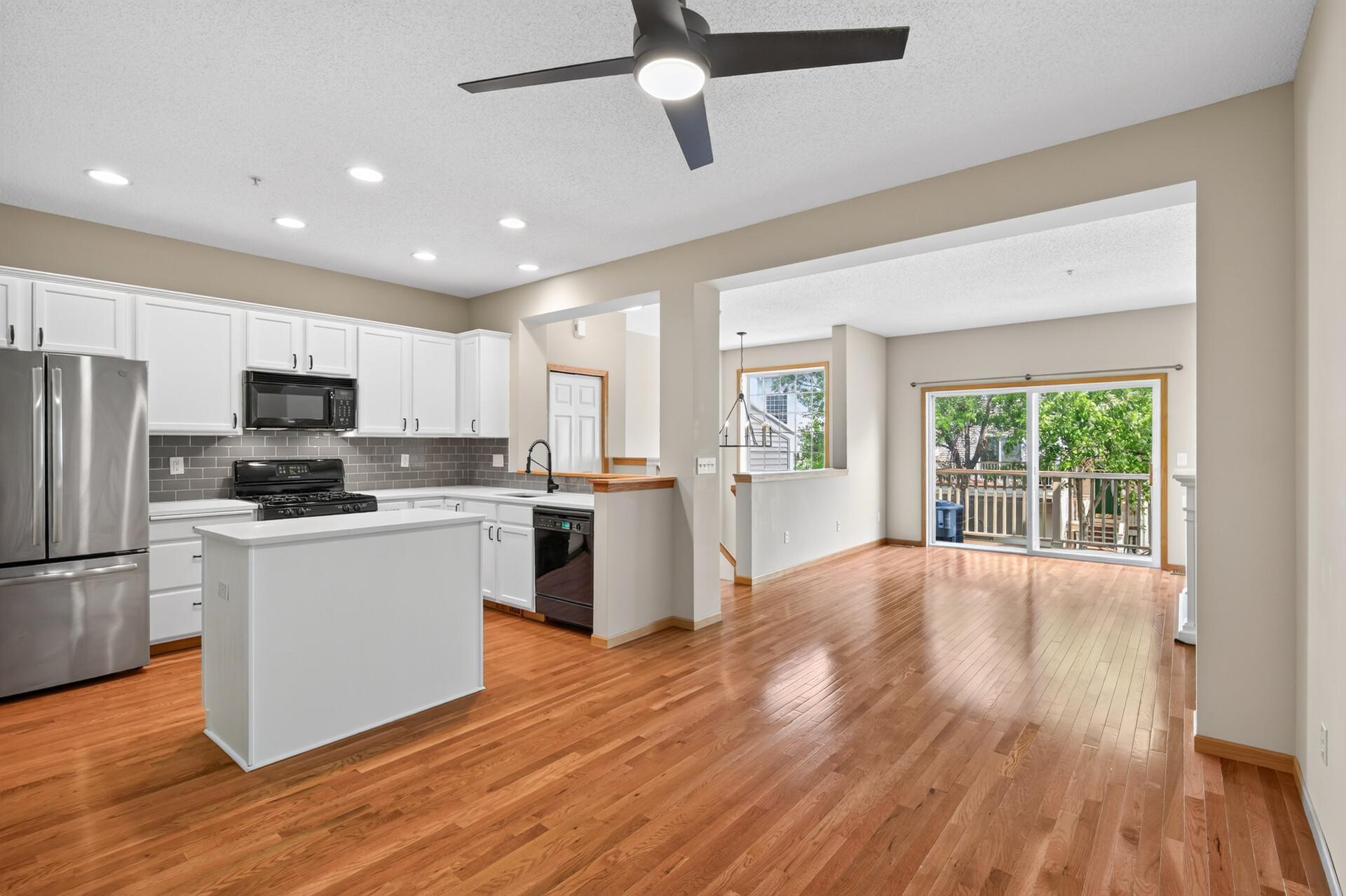 Soaring ceilings and an open-concept layout create an airy, welcoming first impression.