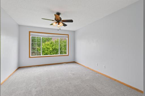 Generous primary suite highlighted by an oversized window and abundant natural light.