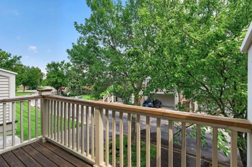 Private deck overlooking mature trees for peaceful outdoor living.