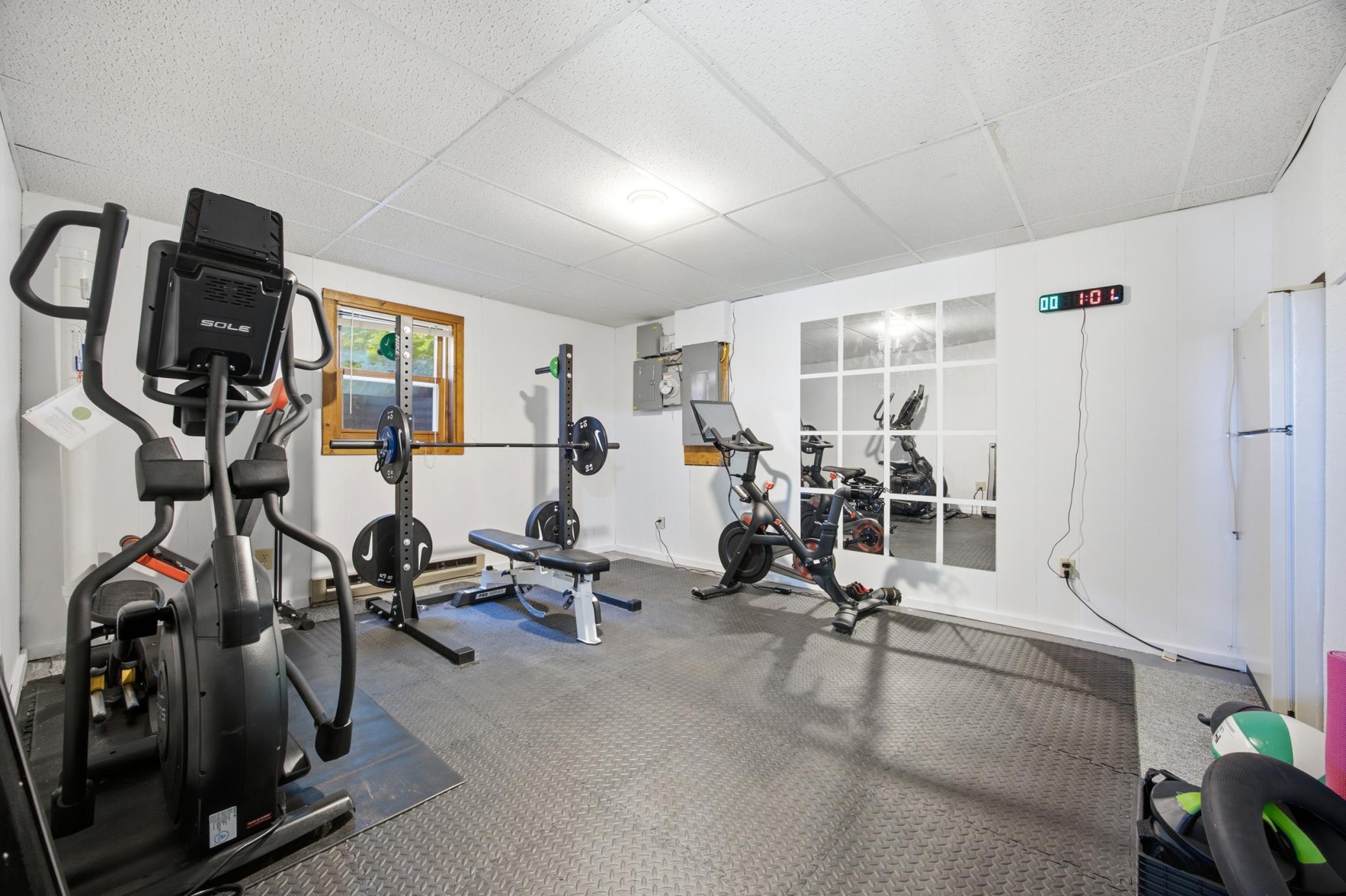 large flex room currently set up as a gym
