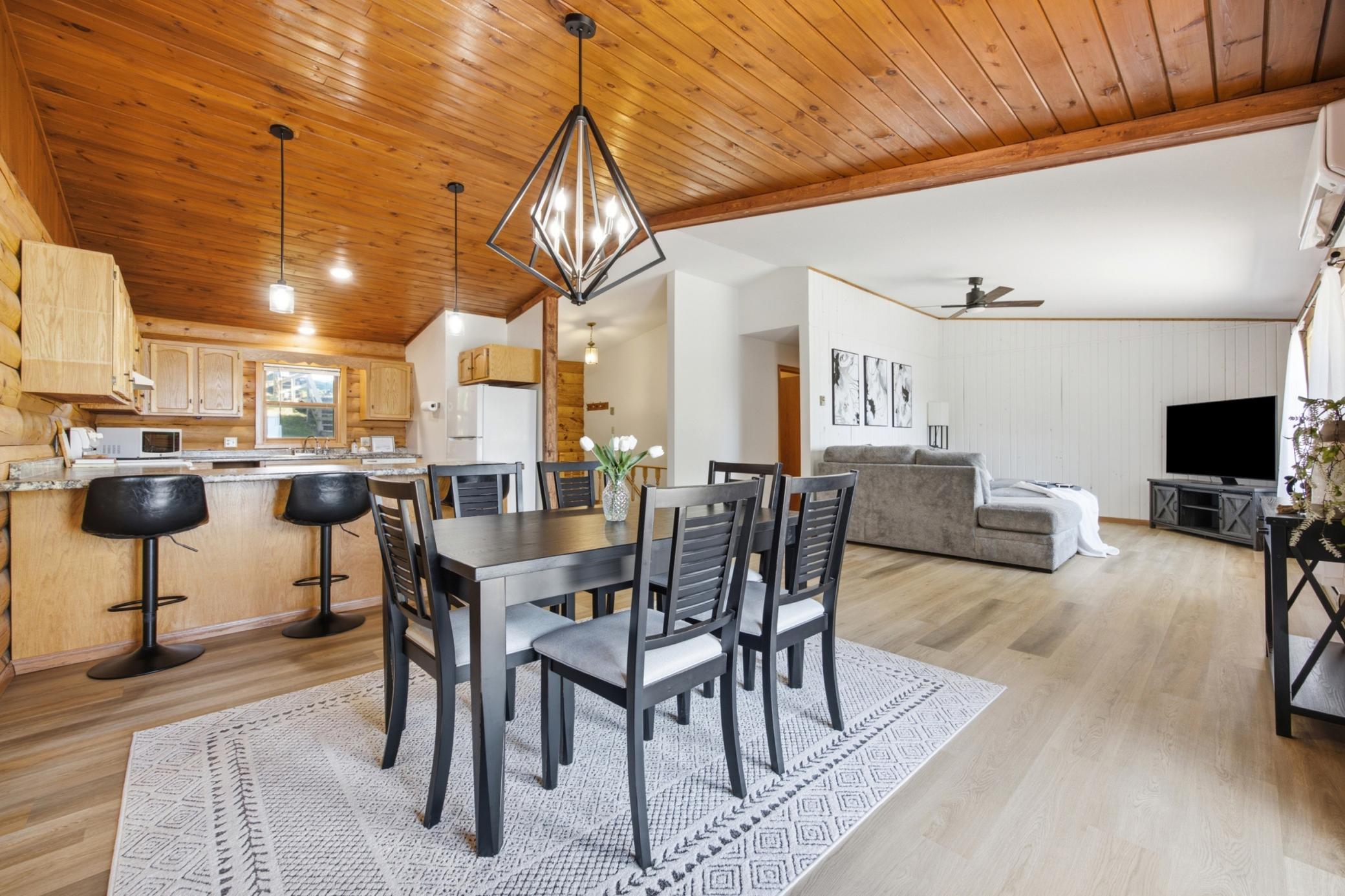 Renovated open floor plan with new vinyl plank flooring throughout the main living space