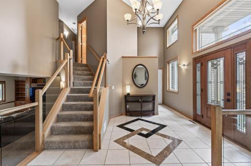 Filled with natural light from updated windows, the inviting foyer offers a beautiful first impression of the home that awaits.