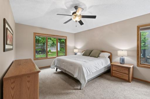 A peaceful primary suite offering the perfect balance of comfort, and privacy