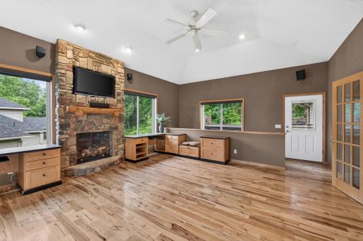 A floor-to-ceiling stone fireplace creates a stunning focal point and adds warmth and character to the entire space.