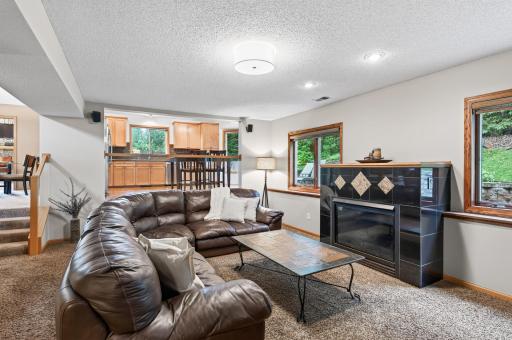 The beautiful tile fireplace creates a cozy focal point for quiet evenings and family gatherings alike.