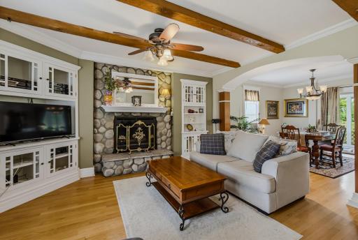 Fieldstone Fireplace Flanked by Built-ins