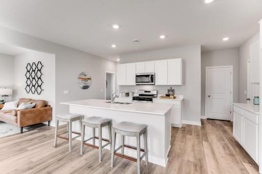 Lots of counter space! *Photo is of a model home. Cabinets in the property for sale are grey.