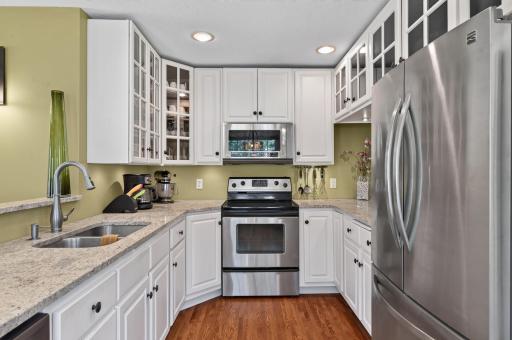 Granite counters, under-cabinet lighting and glass front cabinets!