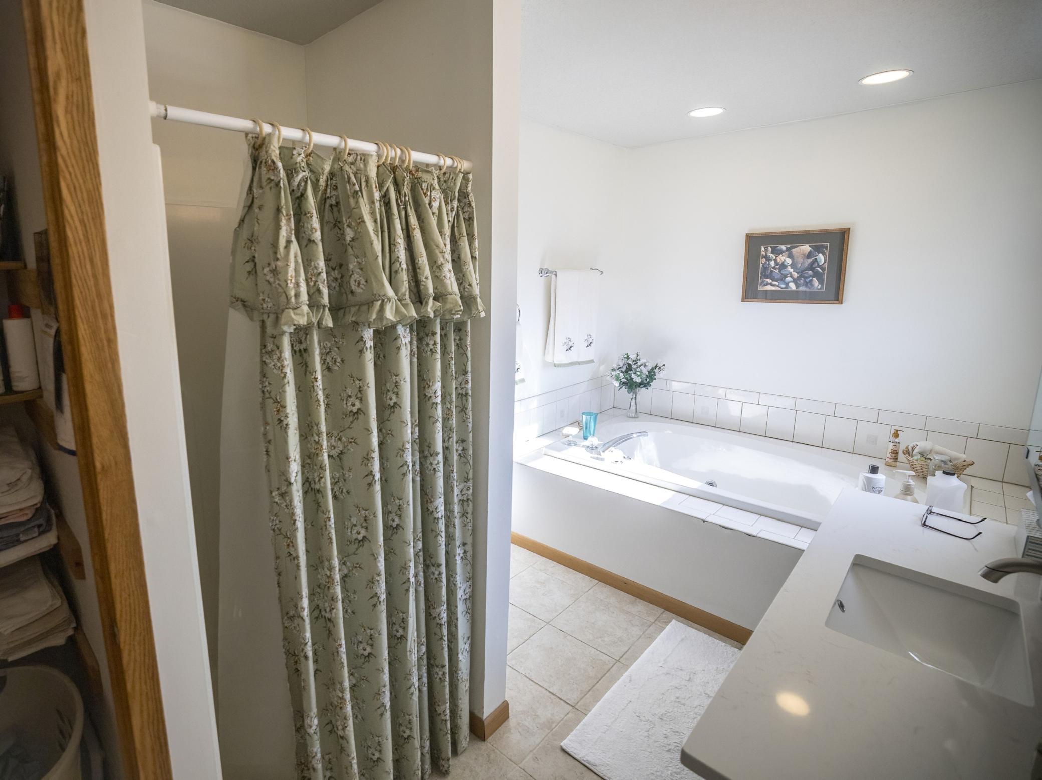 Primary private bath with jacuzzi tub and shower