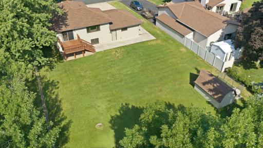 Generously sized new concrete patio & freshly stained deck