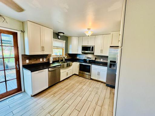 Tiled floors, stainless appliances